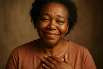 generate an image of a middle age mother black race looking grateful